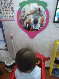 Max at the barber at Haifu Road