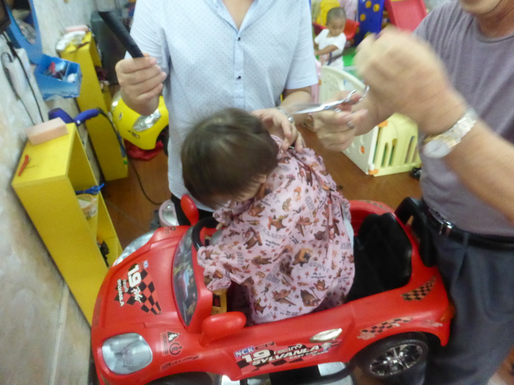 Max and Miaomiao`s father at the barber at Haifu Road