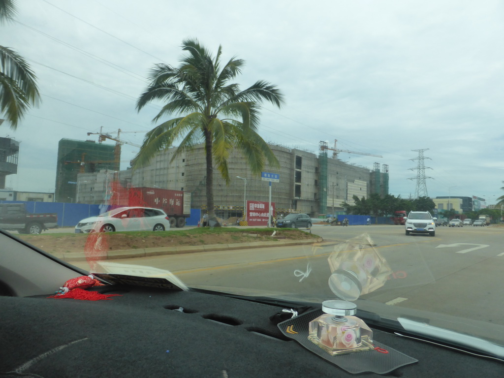 Building under construction at Yehai Avenue, viewed from the car