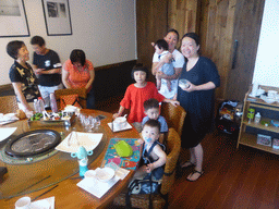 Miaomiao, Max and Miaomiao`s family preparing for lunch at the Xinya Steam Pot restaurant