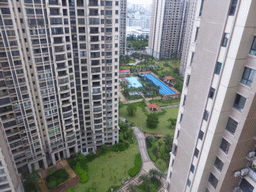 Central garden with swimming pool of the apartment complex of Miaomiao`s sister, viewed from the balcony of the apartment of Miaomiao`s sister