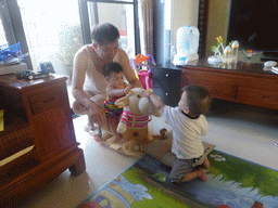 Max with his grandfather and cousin in the apartment of Miaomiao`s sister