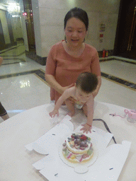 Miaomiao and Max with his birthday cake in the Jinghao Restaurant at Bailong South Road