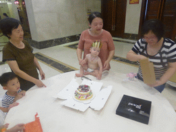 Miaomiao, Max and Miaomiao`s family with Max`s birthday cake in the Jinghao Restaurant at Bailong South Road