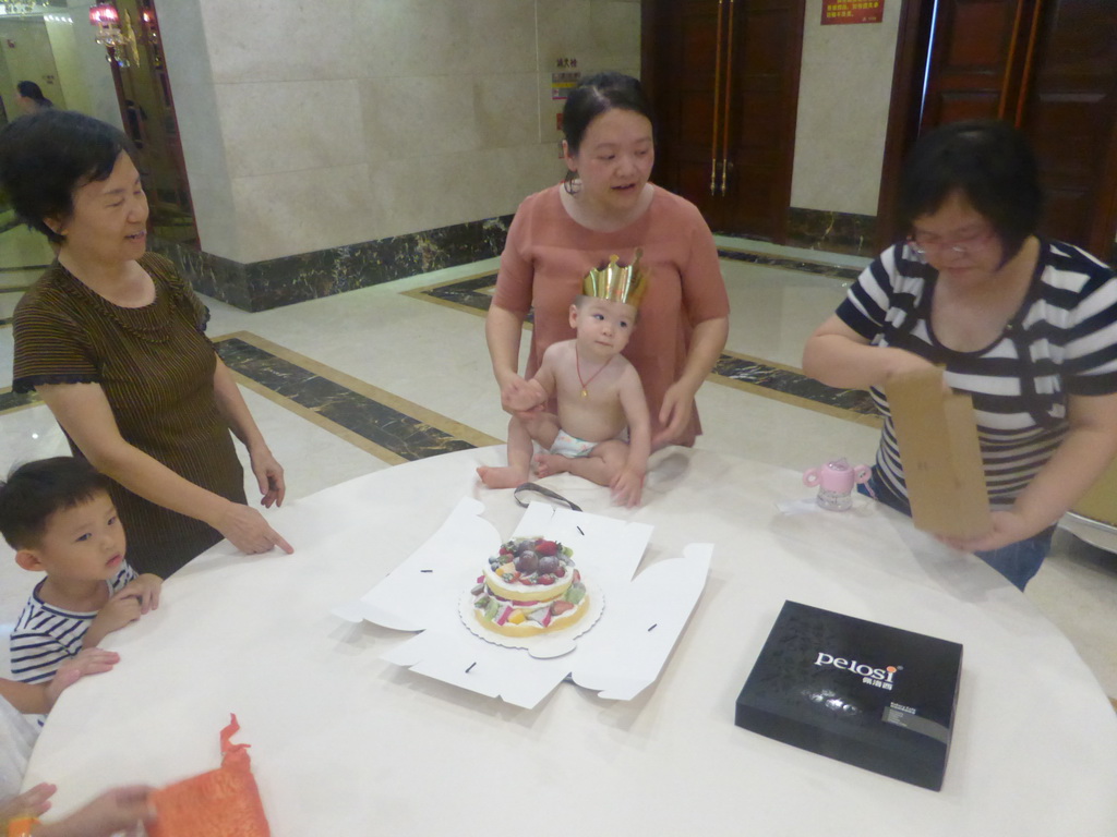 Miaomiao, Max and Miaomiao`s family with Max`s birthday cake in the Jinghao Restaurant at Bailong South Road