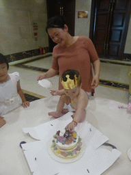 Miaomiao, Max and Miaomiao`s family with Max`s birthday cake in the Jinghao Restaurant at Bailong South Road
