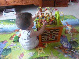 Max playing with his birthday gift in the apartment of Miaomiao`s sister