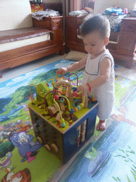 Max playing with his birthday gift in the apartment of Miaomiao`s sister