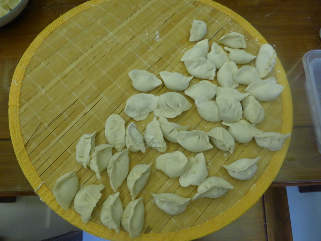 Dumplings being prepared in the apartment of Miaomiao`s sister
