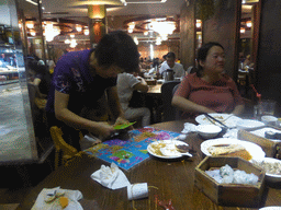 Miaomiao, Max and Miaomiao`s mother having breakfast in a restaurant at Lantian Road