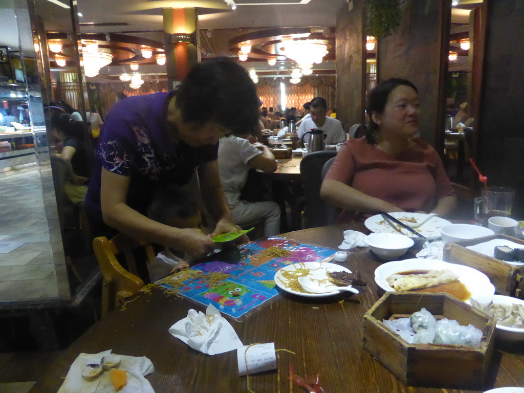 Miaomiao, Max and Miaomiao`s mother having breakfast in a restaurant at Lantian Road