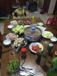 Max having dinner in the apartment of Miaomiao`s sister