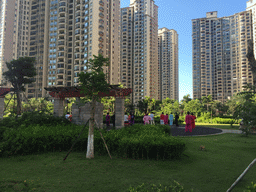 People doing Tai Chi in the central garden of the apartment complex of Miaomiao`s sister