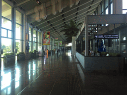 Max and Miaomiao`s father in the Departures Hall of Haikou Meilan International Airport