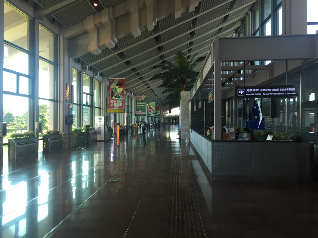 Max and Miaomiao`s father in the Departures Hall of Haikou Meilan International Airport