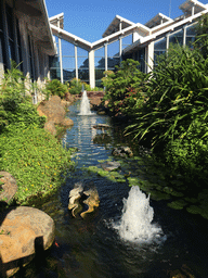 Pool with fountains in the outdoor garden at Haikou Meilan International Airport