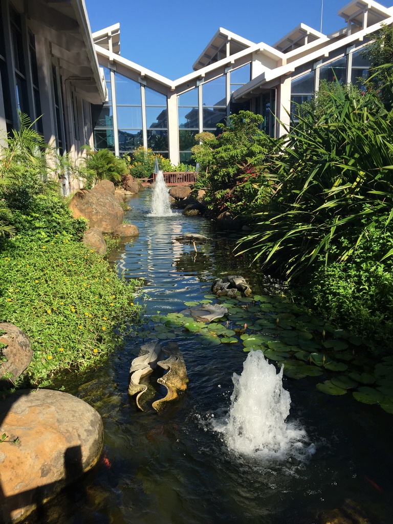 Pool with fountains in the outdoor garden at Haikou Meilan International Airport