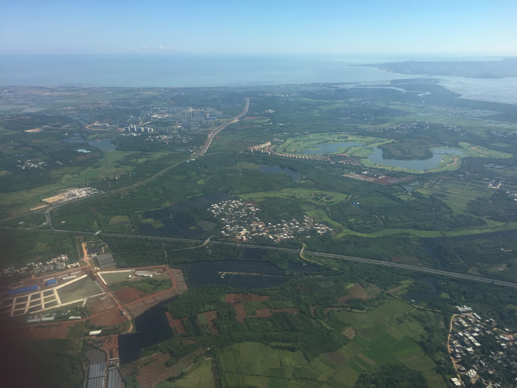 The Hainan Meilan Golf Club, Puqiangang Bay and Dongzhai Harbour, viewed from the airplane to Bangkok