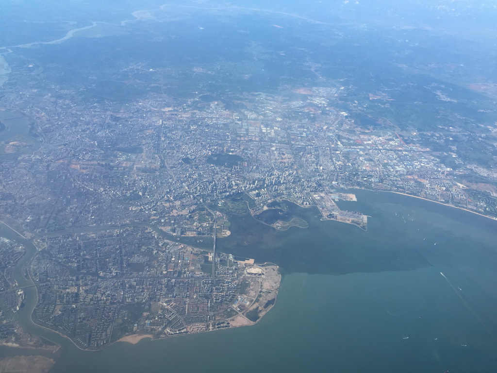 The city center with Haikou Bay and the Baishamen Port, viewed from the airplane to Bangkok