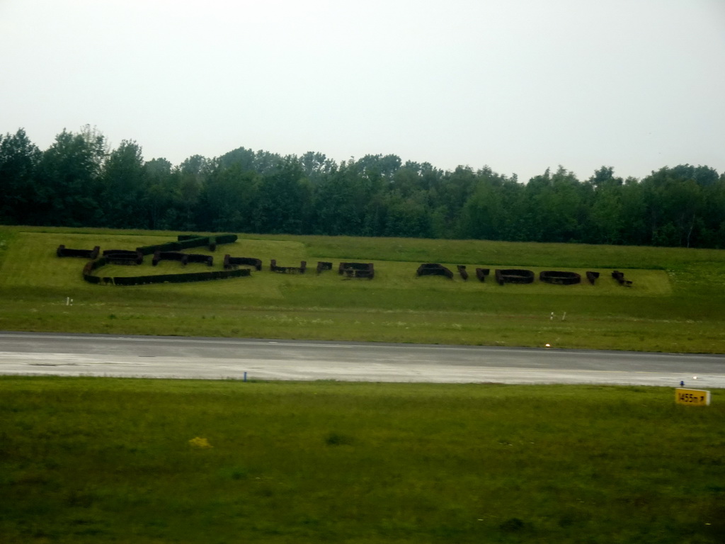 Logo of Hamburg Airport in the grass, viewed from the airplane from Amsterdam