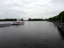 Boats and the Alster Fountains at the Binnenalster lake, viewed from the Ballindamm street