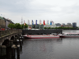 Boats at the southwest side of the Binnenalster lake, the Jungfernstieg boulevard and the Heinrich-Hertz-Turm tower, viewed from the Ballindamm street