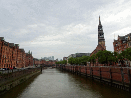 The Zollkanal canal, the St. Katharinen Church and the Elbphilharmonie concert hall, viewed from the bridge at the north side of the Bei St. Annen street