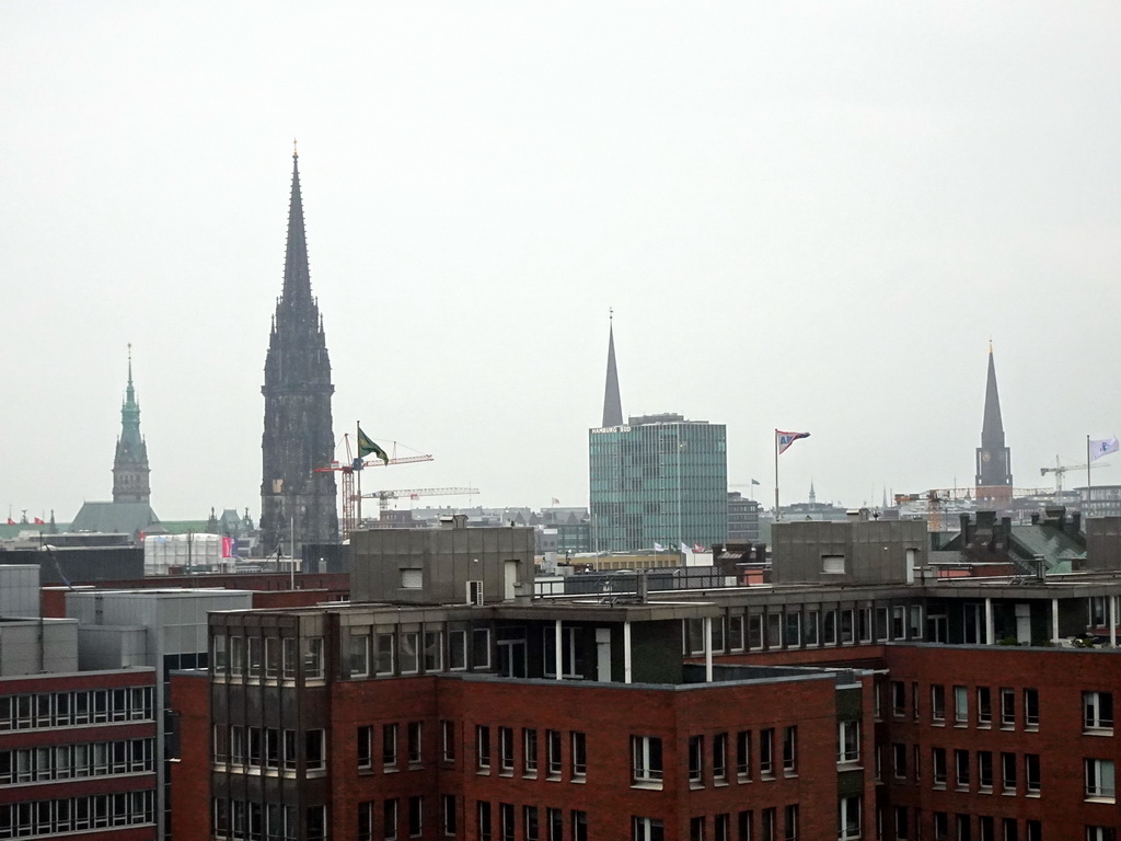 Northeast side of the city with the towers of the City Hall, the St. Nikolai Memorial, St. Peters Church`and St. James` Church, viewed from the viewing point of the Elbphilharmonie concert hall