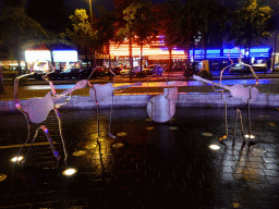 The Beatles Platz square with a steel statue of the Beatles, and the Reeperbahn street, by night