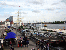 Boats in the Elbe river, the St. Pauli Piers and the Elbphilharmonie concert hall, viewed from the pedestrian bridge over the St. Pauli Hafenstraße street