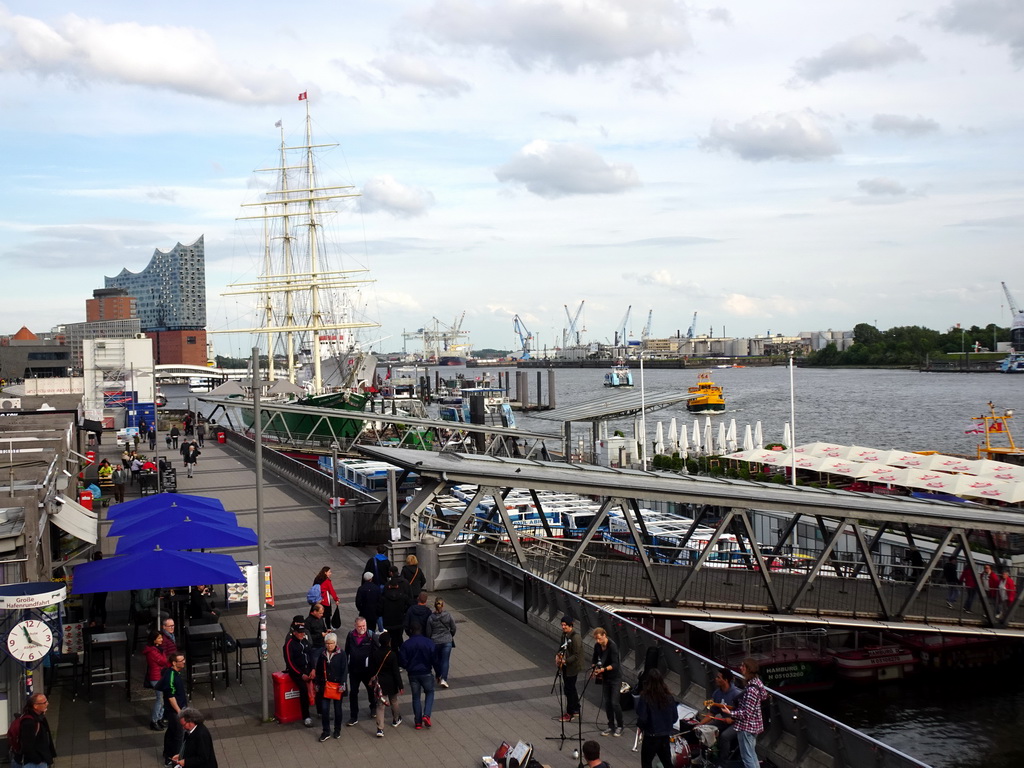 Boats in the Elbe river, the St. Pauli Piers and the Elbphilharmonie concert hall, viewed from the pedestrian bridge over the St. Pauli Hafenstraße street