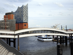The Überseebrücke bridge, the Elbe river and the Elbphilharmonie concert hall, viewed from the Elbpromenade