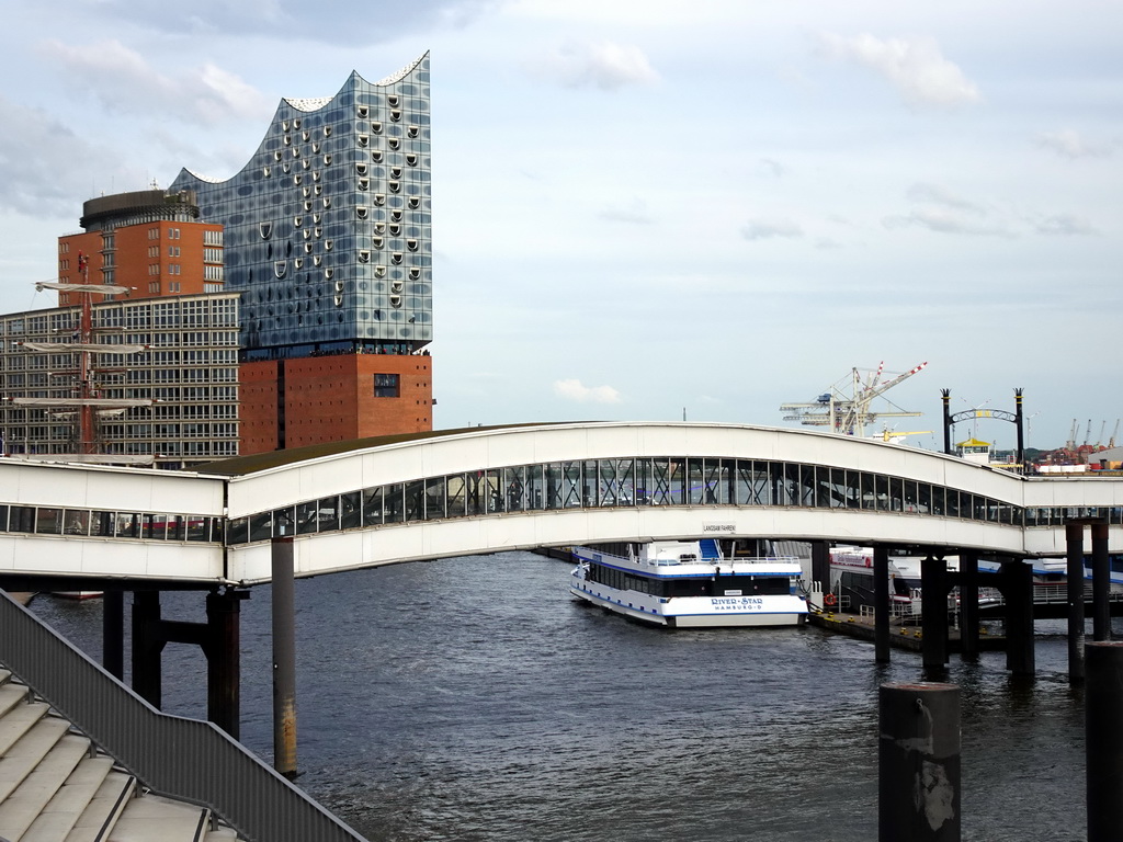 The Überseebrücke bridge, the Elbe river and the Elbphilharmonie concert hall, viewed from the Elbpromenade