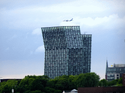 Airplane flying above the Dancing Towers, viewed from the viewing point of the Elbphilharmonie concert hall