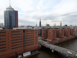 The Hanseatic Trade Center, the Am Kaiserkai bridge over the Sandtorhafen harbour and the towers of the City Hall, the St. Nikolai Memorial, St. Peters Church, St. James` Church and St. Katharinen Church, viewed from the viewing point of the Elbphilharmonie concert hall