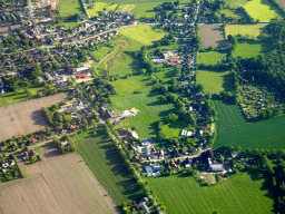 Grasslands and houses on the north side of the city, viewed from the airplane to Amsterdam