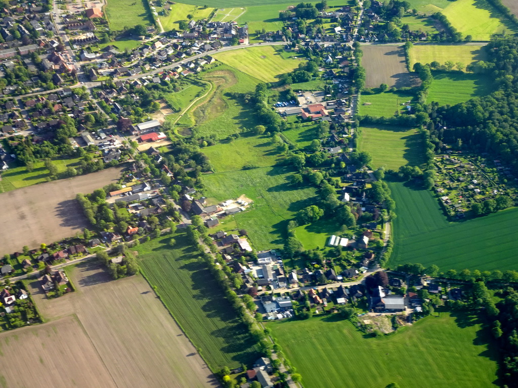 Grasslands and houses on the north side of the city, viewed from the airplane to Amsterdam