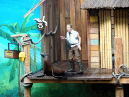 Zookeeper and California Sea Lion during the `Avontureneiland en het Magische Amulet` show at the Zoete Zeeleeuwentheater at the Dolfinarium Harderwijk