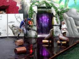 Zookeepers and California Sea Lions during the `Avontureneiland en het Magische Amulet` show at the Zoete Zeeleeuwentheater at the Dolfinarium Harderwijk