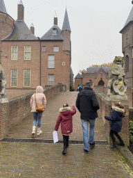 Miaomiao, Max and Max`s uncle and cousins on the bridge from the gardens to the main building of the Heeswijk Castle