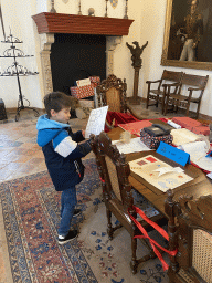 Max with the scavenger hunt at the meeting room at the ground floor of the main building of the Heeswijk Castle, during the `Sint op het Kasteel 2022` event