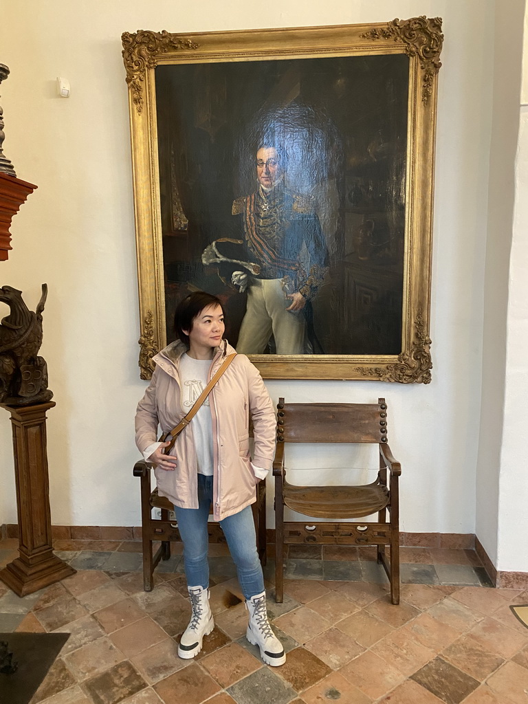 Miaomiao with a painting of the Baron van den Bogaerde van Terbrugge at the meeting room at the ground floor of the main building of the Heeswijk Castle, during the `Sint op het Kasteel 2022` event