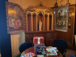Cabinet with paintings and table with presents at the writing room at the first floor of the main building of the Heeswijk Castle, during the `Sint op het Kasteel 2022` event