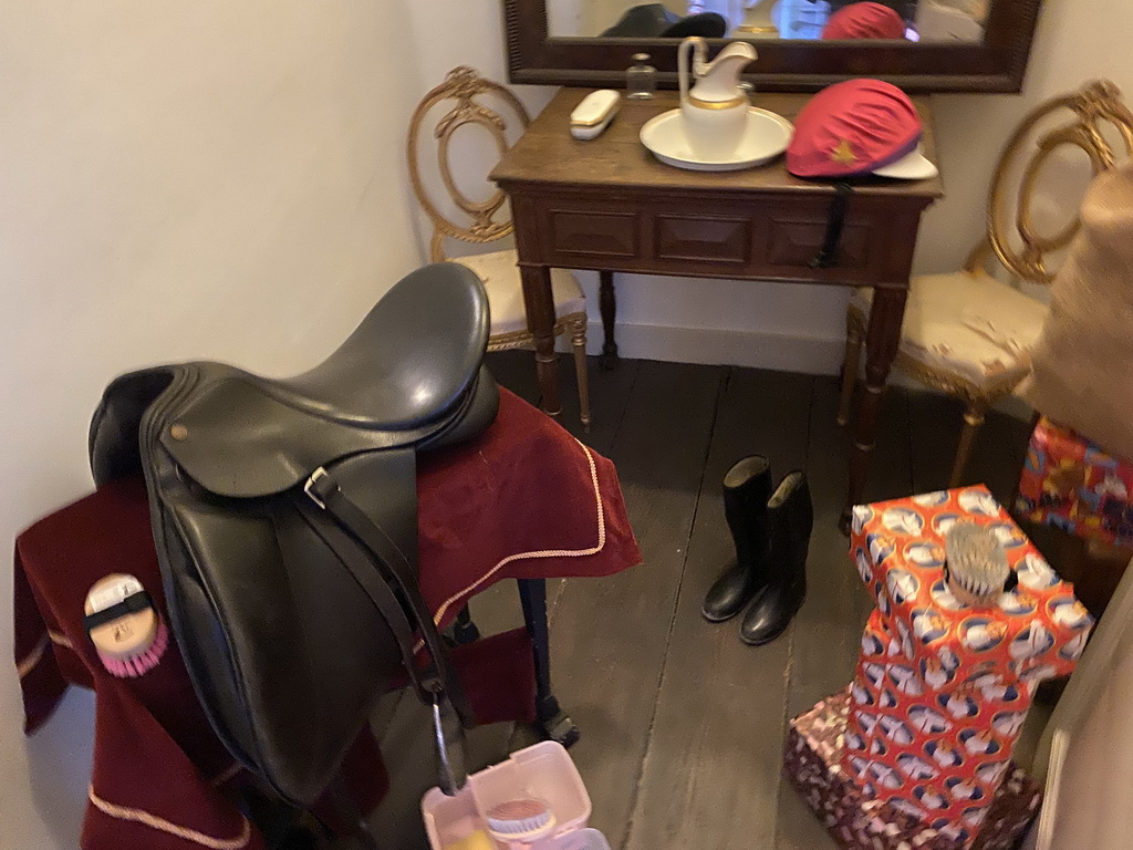 Saddle, boots and presents at the horseriding room at the first floor of the main building of the Heeswijk Castle, during the `Sint op het Kasteel 2022` event