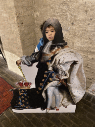Max with a cardboard of King Louis XIV at the museum room at the basement of the main building of the Heeswijk Castle, during the `Sint op het Kasteel 2022` event