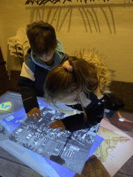 Max and his cousin with a screen at the history room at the basement of the main building of the Heeswijk Castle, during the `Sint op het Kasteel 2022` event