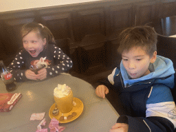 Max having a hot chocolate and his cousin at the restaurant of the Heeswijk Castle