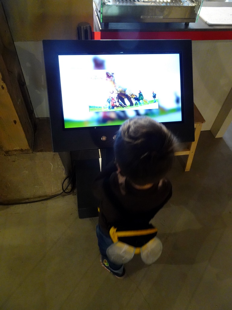 Max with a screen at the ground floor of the main building of the HistoryLand museum