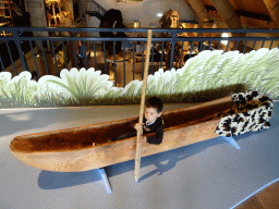 Max in a canoe at the upper floor of the main building of the HistoryLand museum