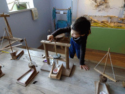 Max playing with prehistoric tools at the upper floor of the main building of the HistoryLand museum